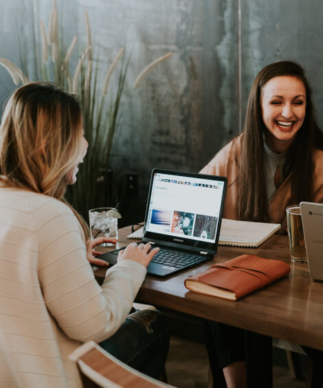 People laughing around a table